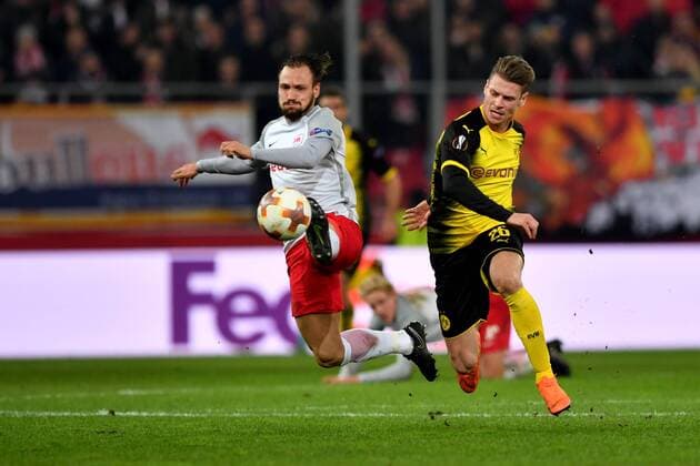 SOCCER - UEFA EL, RBS vs Dortmund SALZBURG,AUSTRIA,15.MAR.18 - SOCCER - UEFA Europa League, round of 16, Red Bull Salzburg vs Borussia Dortmund. Image shows Andreas Ulmer (RBS) and Lukasz Piszczek (Dortmund). GEPAxpictures xFlorianxErtl