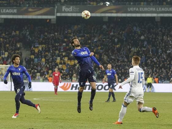 March 15, 2018 - Kiev, Ukraine - S.S. Lazio FC s player Marco Parolo vies for a ball with Dynamo Kyiv FC s Viktor Tsygankov during the 2nd leg of Round 16 UEFA Europa League match at a NSC Olimpiyskyi in Kyiv, Ukraine, March 15, 2018. Dynamo Kiev v Lazio - UEFA Europa League Round of 16: Second Leg  - ZUMAn230 20180315_zaa_n230_522 Copyright: xSergiixKharchenkox