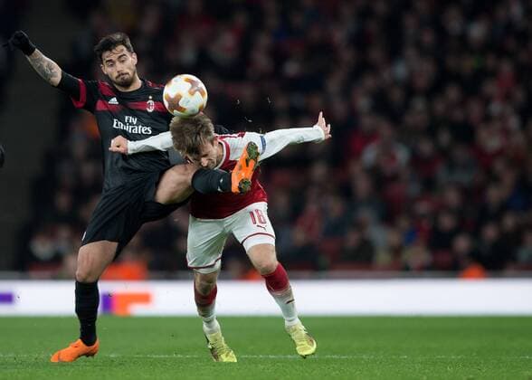 Suso of AC Milan kicks Nacho Monreal of Arsenal in the face during the UEFA Europa League round of 16 2nd leg match between Arsenal and AC Milan at the Emirates Stadium, London, England on 15 March 2018. Copyright: xVincexxMignottx PMI-1884-0026