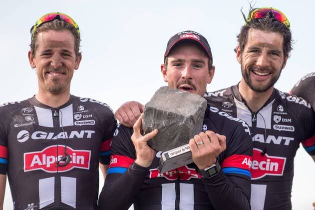 - ROUBAIX, FRANCE: Dutch Koen de Kort of Team Giant-Alpecin, German John Degenkolb of Team Giant-Alpecin and Dutch Roy Curvers of Team Giant-Alpecin celebrate on the podium after the Paris-Roubaix one day cycling race, 253,5 km from Compiegne to the Velodrome in Roubaix, Sunday 12 April 2015. LUCxCLAESSEN  x78198734x