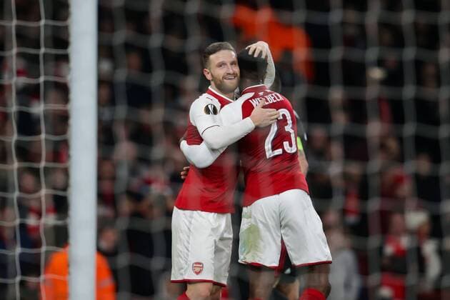 (180316) -- LONDON, March 16, 2018 -- Danny Welbeck (R) of Arsenal celebrates scoring with teammate Shkodran Mustafi during the UEFA Europa League round of 16 second-leg match against AC Milan at the Emirates Stadium in London, Britain on March 15, 2018. Arsenal beat AC Milan 3-1 and advanced to the quarterfinal with a 5-1 aggregate. ) (SP)BRITAIN-LONDON-SOCCER-EUROPA LEAGUE-ARSENAL VS AC MILAN RichardxWashbrooke 