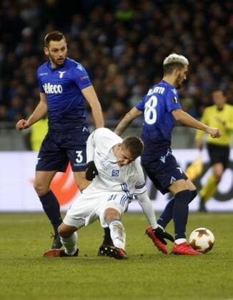 March 15, 2018 - Artem Besedin (C) of Dynamo vies for the ball with Stefan de Vrij (L) and Luis Alberto (R) of Lazio during the Europa League round 16 second leg football match between FC Dynamo Kyiv and SS Lazio, at the Olimpiyskyi stadium in Kyiv, Ukraine, March 15, 2018. Europa League round 16 second leg football match between FC Dynamo Kyiv and SS Lazio - ZUMAs334 82331966st Copyright: xAnatoliixStepanovx