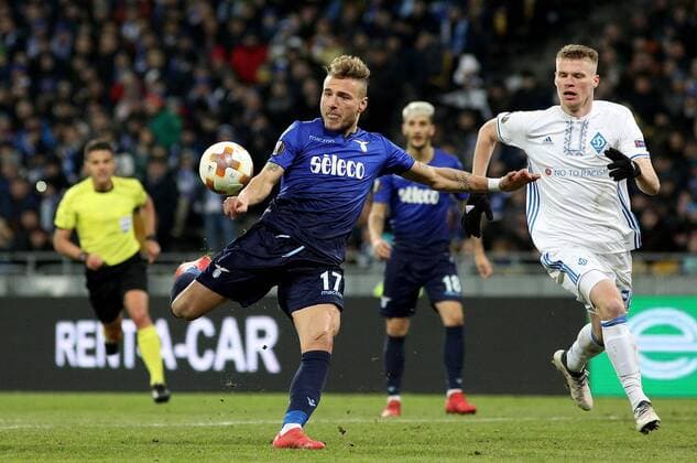 Forward Ciro Immobile (C) of S.S. Lazio and defender Mykyta Burda (R) of FC Dynamo Kyiv are seen in action during the UEFA Europa League Round of 16 2nd leg match at the NSC Olimpiyskiy, Kyiv, capital of Ukraine, March 15, 2018. Ukrinform. KYIV. FC Dynamo Kyiv has been defeated by S.S. Lazio 0-2 in the UEFA Europa League Round of 16 2nd leg game at the NSC Olimpiyskiy. The tie wrapped with a 2-4 aggregate win for the Italian side. Visitors midfielder Lucas and defender Stefan de Vrij scored in the 23rd and 83rd minutes respectively. Thus, the Rome-based club advanced to the quarterfinals. Dynamo loses 0-2 to Lazio in Kyiv  Copyright: xDanilxShamkinx