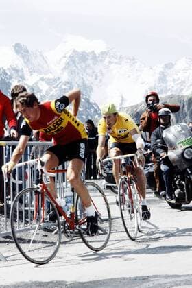 Belgian Paul Wellens leads in front of Dutchman Joop Zoetemelk, wearing the leader s yellow jersey, as they ride uphill during the 17th stage of the Tour de France between Serre-Chevalier and Morzine on July 14, 1980. Zoetemelk finished 13th of the stage won by Frenchman Mariano Martinez but went on to win his first and only Tour de France in Paris.  x82107708x