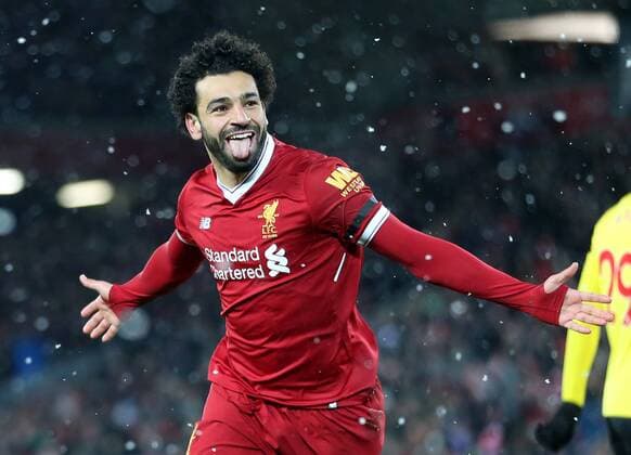 17th March 2018, Anfield, Liverpool, England; EPL Premier League football, Liverpool versus Watford; Mohammed Salah of Liverpool celebrates in front of the Kop after completing his hat trick  ActionPlus12002908