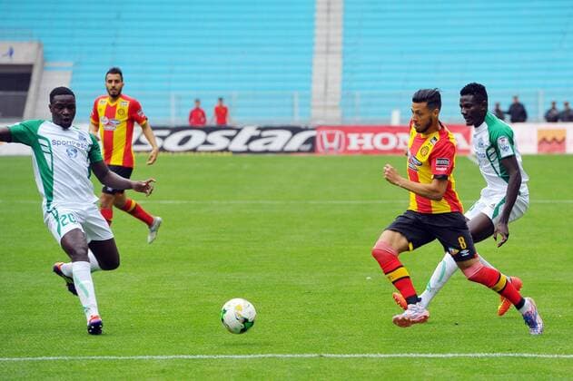 Anis Badri (8) and Wendo Ernest (20) during the match Esperance Sportive de Tunis who validated his ticket to the group phase of the African Champions League after a short victory of (1-0) face Gor Mahia Kenyan club in the second leg of the final of the competition sixteenths played at Rades stadium. African Champions League:EST vs Gor Mahia. 