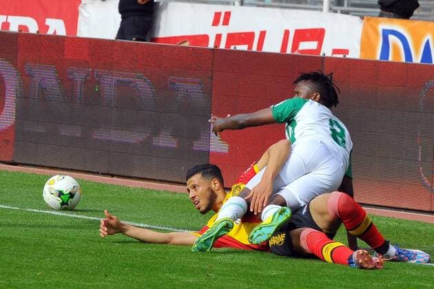 Anis Badri (8) and Shakava Haron (8) during the match Esperance Sportive de Tunis who validated his ticket to the group phase of the African Champions League after a short victory of (1-0) face Gor Mahia Kenyan club in the second leg of the final of the competition sixteenths played at Rades stadium. African Champions League:EST vs Gor Mahia. 