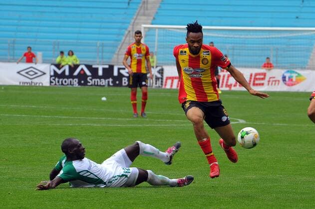 Foussent Colibaly(R)and Onyango Joash (12) during the match Esperance Sportive de Tunis who validated his ticket to the group phase of the African Champions League after a short victory of (1-0) face Gor Mahia Kenyan club in the second leg of the final of the competition sixteenths played at Rades stadium. African Champions League:EST vs Gor Mahia. 