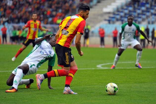 Anis Badri (8) and Otieno Philemon (26) during the match Esperance Sportive de Tunis who validated his ticket to the group phase of the African Champions League after a short victory of (1-0) face Gor Mahia Kenyan club in the second leg of the final of the competition sixteenths played at Rades stadium. African Champions League:EST vs Gor Mahia. 