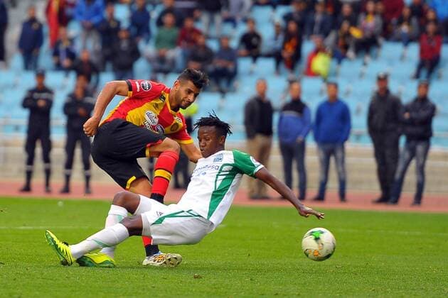 Houcine Erbeia(L) and Philemon Otieno(R) during the match Esperance Sportive de Tunis who validated his ticket to the group phase of the African Champions League after a short victory of (1-0) face Gor Mahia Kenyan club in the second leg of the final of the competition sixteenths played at Rades stadium. African Champions League:EST vs Gor Mahia. 