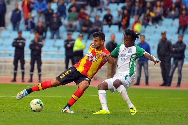 Houcine Erbeia(L) and Philemon Otieno(R) during the match Esperance Sportive de Tunis who validated his ticket to the group phase of the African Champions League after a short victory of (1-0) face Gor Mahia Kenyan club in the second leg of the final of the competition sixteenths played at Rades stadium. African Champions League:EST vs Gor Mahia. 