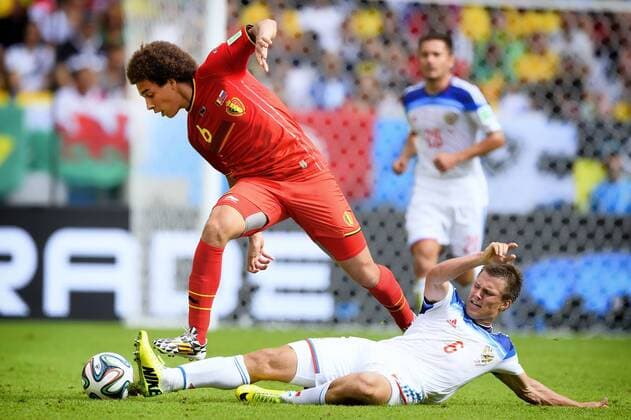 - RIO DE JANEIRO, BRAZIL: Belgium s Axel Witsel and Russia s Maksim Kanunnikov fight for the ball during a soccer game between Belgian national team Nationalteam The Red Devils and Russia in Rio de Janeiro, Brazil, the second game in Group H of the first round of the 2014 FIFA World Cup WM Weltmeisterschaft Fussball Sunday 22 June 2014. YORICKxJANSENS  x59620485x