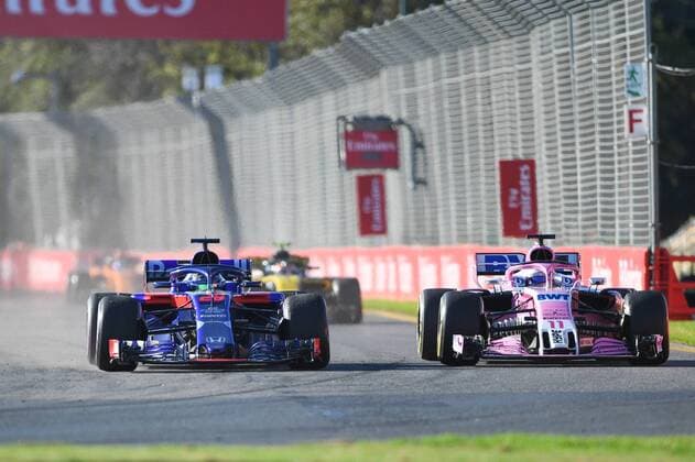 23rd March 2018, Melbourne Grand Prix Circuit, Melbourne, Australia; Melbourne Formula One Grand Prix, Friday free practice; Brendon Hartley of New Zealand driving the (28) Scuderia Toro Rosso STR13 Honda alongside Sergio Perez of Mexico, who is driving the (11) Sahara Force India F1 Team VJM11 Mercedes  ActionPlus12004254