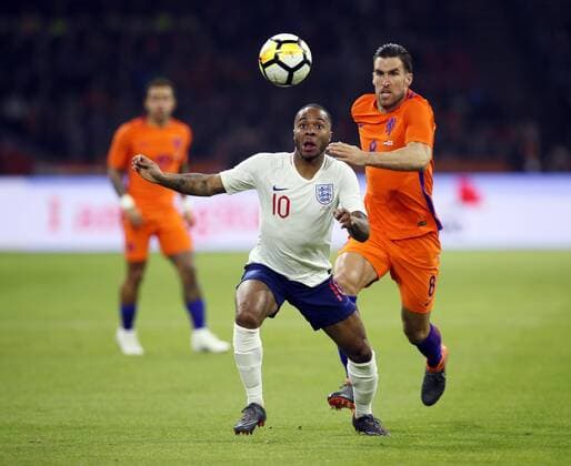 Netherland s Kevin Strootman tussles with England s Raheem Sterling during the International Friendly Länderspiel match at the Amsterdam Arena, Amsterdam. Picture date: March 23rd 2018. Picture credit should read: David Klein Sportimage EDITORIAL USE ONLY. No use with unauthorised audio, video, data, fixture lists, club league logos or live services. Online in-match use limited to 120 images, no video emulation. No use in betting, games or single club league player publications.