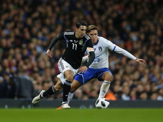 23rd March 2018, Etihad Stadium, Manchester, England; International Football Friendly, Italy versus Argentina; Angel Di Mar& xed;a of Argentina holds off the challenge of Federico Chiesa of Italy  ActionPlus12004414