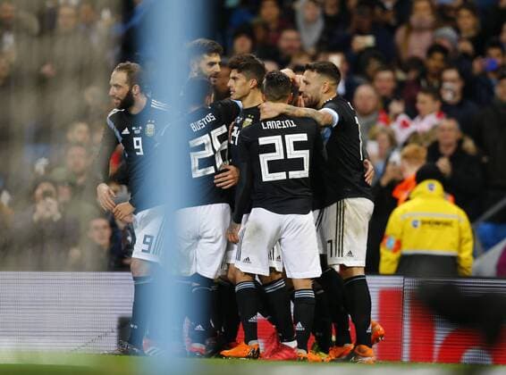23rd March 2018, Etihad Stadium, Manchester, England; International Football Friendly, Italy versus Argentina; Argentina players congratulate Ever Banega of Argentina after he scores his side s opening goal after 75 minutes  ActionPlus12004537