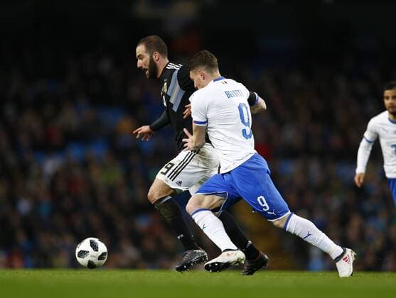 23rd March 2018, Etihad Stadium, Manchester, England; International Football Friendly, Italy versus Argentina; Andrea Belotti of Italy tussles with Gonzalo Higua& xed;n of Argentina  ActionPlus12004547