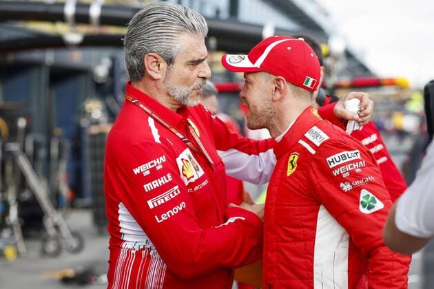 Bilder des Tages - SPORT ARRIVABENE Maurizio, Managing Director & Team Principal Scuderia Ferrari, VETTEL Sebastian (ger), Scuderia Ferrari SF71H, portrait during 2018 Formula 1 championship at Melbourne, Australian Grand Prix, from March 22 To 25 - s: FIA Formula One World Championship WM Weltmeisterschaft 2018, Melbourne, Victoria : Motorsports: Formula 1 2018 Rolex Australian Grand Prix, Melbourne Australia