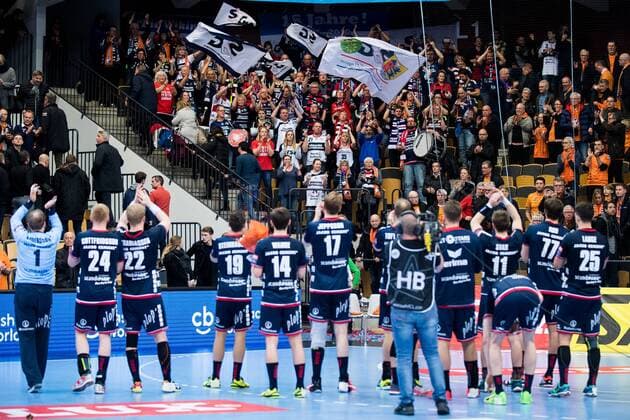 180324 Flensburg askers cheer with their players after the end of the handball match in the Champions League between Kristianstad and Flensburg on March 24, 2018 in Kristianstad  Copyright: AvdoxBilkanovic BB180324AB017