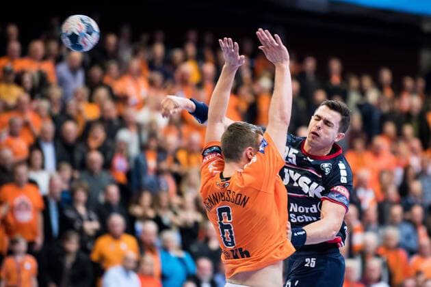 180324 Flensburg Rasmus Lauge and Kristianstads Philip Henningsson during the Champions League match between Kristianstad and Flensburg on March 24, 2018 in Kristianstad  Copyright: AvdoxBilkanovic BB180324AB019