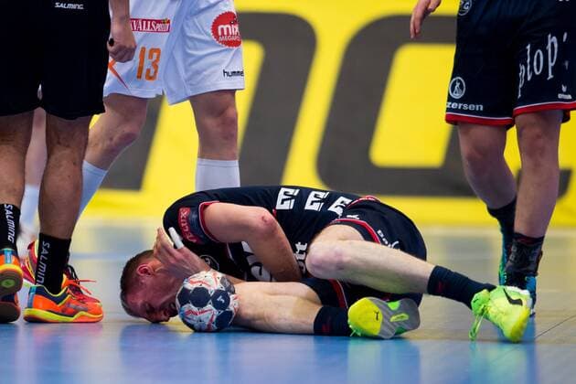180324 Flensburg Holger Glandorf was injured during the handball match in the Champions League between Kristianstad and Flensburg on March 24, 2018 in Kristianstad  Copyright: AvdoxBilkanovic BB180324AB050