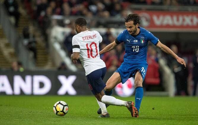 Marco Parolo (Lazio) of Italy trips Raheem Sterling (Manchester City) of England ahead of the first goal during the International Friendly L?nderspiel match between England and Italy at Wembley Stadium, London, England on 27 March 2018. Copyright: xAndyxRowlandx PMI-1927-0009