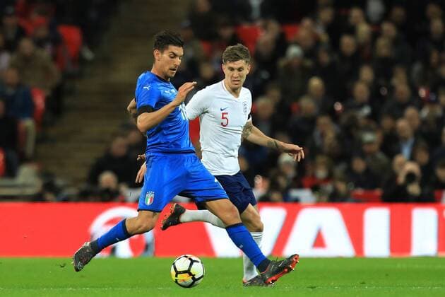 27th March 2018, Wembley Stadium, London, England; International Football Friendly, England versus Italy; Lorenzo Pellegrini of Italy under pressure from John Stones of England  ActionPlus12006081