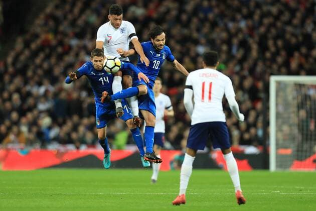 27th March 2018, Wembley Stadium, London, England; International Football Friendly, England versus Italy; Alex Oxlade-Chamberlain of England wins the header against Jorginho and Marco Parolo of Italy  ActionPlus12006092
