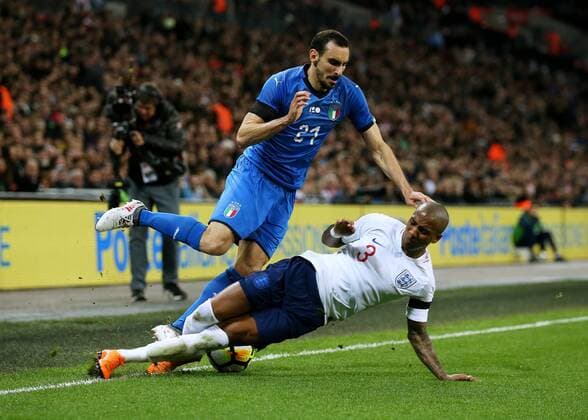 27th March 2018, Wembley Stadium, London, England; International Football Friendly, England versus Italy; Ashley Young of England aggressively fouls Davide Zappacosta of Italy with a slide tackle  ActionPlus12006095