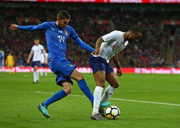27th March 2018, Wembley Stadium, London, England; International Football Friendly, England versus Italy; Frello Filho of Italy puts pressure on Raheem Sterling of England  ActionPlus12006101