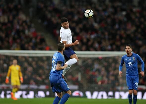 27th March 2018, Wembley Stadium, London, England; International Football Friendly, England versus Italy; Alex Oxlade-Chamberlain of England jumps to head the ball over Bonucci into attack  ActionPlus12006104