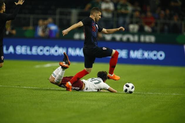 March 27, 2018 - Arlington, Texas, USA - March 27, 2018, Arlington Tx., USA. Ante Rebic (18) takes the ball from Omar Govea (20) during the first half of the Mexico vs Croatia International Friendly Länderspiel match at ATT Stadium in Arlington, Texas. Mexico vs Croatia - ZUMAl92_ 20180327_zaf_l92_001 Copyright: xRalphxLauerx