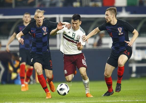 March 27, 2018 - Arlington, Texas, USA - March 27, 2018, Arlington Tx., USA. Hiring Lozano (8) of Mexico is pulled down by Domagoj Vida (21) and Filip Barbaric (24) of Croatia during the second half of the Mexico vs Croatia International Friendly Länderspiel match at ATT Stadium in Arlington, Texas. Mexico vs Croatia - ZUMAl92_ 20180327_zaf_l92_007 Copyright: xRalphxLauerx