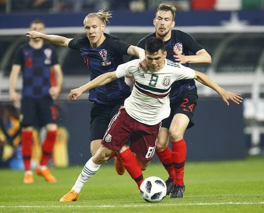 March 27, 2018 - Arlington, Texas, USA - March 27, 2018, Arlington Tx., USA. Hiring Lozano (8) of Mexico is pulled down by Domagoj Vida (21) and Filip Barbaric (24) of Croatia during the second half of the Mexico vs Croatia International Friendly Länderspiel match at ATT Stadium in Arlington, Texas. Mexico vs Croatia - ZUMAl92_ 20180327_zaf_l92_018 Copyright: xRalphxLauerx