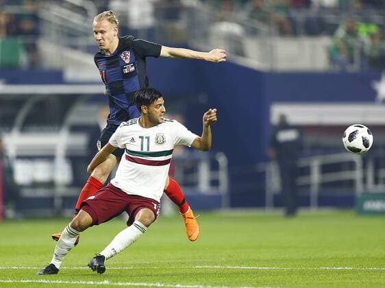 March 27, 2018 - Arlington, Texas, USA - March 27, 2018, Arlington Tx., USA. Domagoj Vida (21) of Croatia Carlos Vela (11) of Mexico fight for position during the second half of the Mexico vs Croatia International Friendly Länderspiel match at ATT Stadium in Arlington, Texas. Mexico vs Croatia - ZUMAl92_ 20180327_zaf_l92_022 Copyright: xRalphxLauerx