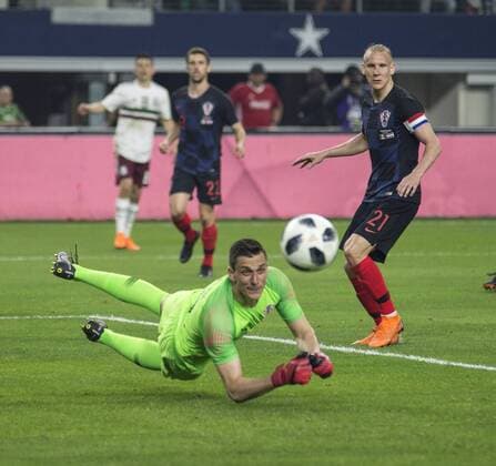 March 27, 2018 - Arlington, Texas, U.S.A - Croatia wins 1-0 against Mexico s national team Nationalteam Goalkeeper for Croatia 12 LOVRE KALINIC stopping Mexico s offensive final attempt for a goal. Mexican National Team vs Croatia U.S. 2018 - ZUMAm147 20180327_zap_m147_011 Copyright: xHossxMcBainx