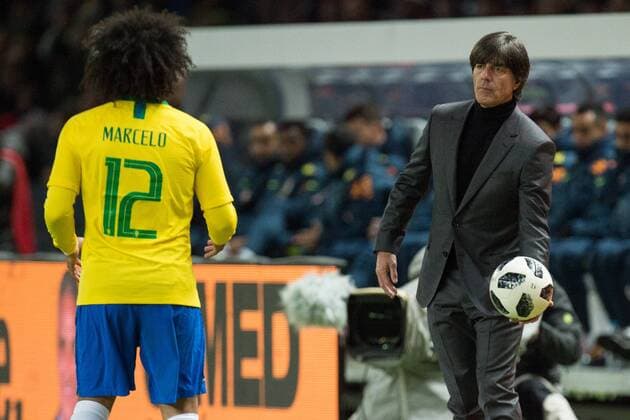 Joachim LOEW re Löw Jogi national coach GER gives MARCELO BRA the ball half figure half figure Soccer Laender match Friendly Match Germany GER Brazil BRA 0 1 on 27 03 2018 in Berlin Germany Â
