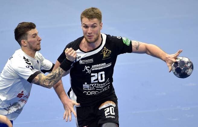 29 03 2018 Handball 2 Bundesliga HC Elbflorenz Dresden Dessau Rosslauer HV 24 21 Dresdens Nils Kretschmer is beset by Dessaus Marek Vanco c