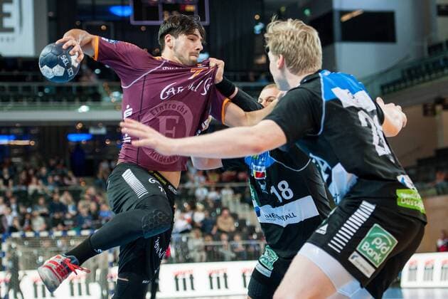 Attack over Savvas Savvas No. 77 Hildesheim Teo Coric No. 18 Vikings and Thomas Bahn No. 24 Vikings try to prevent him from completing HC Rhein Vikings vs. Eintracht Hildesheim Handball 2 Bundesliga 31 03 18 Dusseldorf NRW Germany Castello Copyright: xcdn_nszx