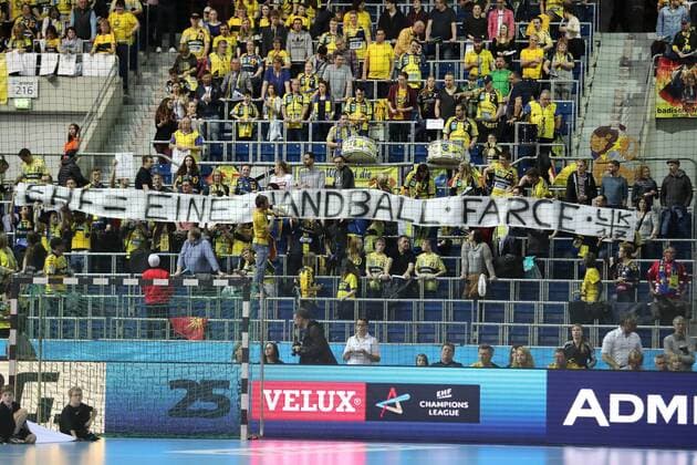 Fans of the Rhein Neckar Löwen with the banner EHF A handball farce protest against the Association Fans Audience Spectators Atmosphere Atmosphere Stadium Handball Champions League Rhein Neckar Löwen PGE Vive Kielce xozx