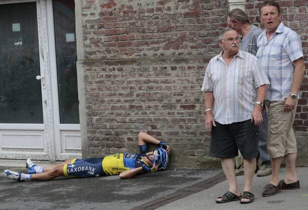 Team Saxo Bank-Tinkoff Bank procycling team rider Jonathan Cantwell of Australia crashes during the 5 th stage of the Tour de France 2012 cycling race between Rouen and Saint-Quentin, 5 July 2012. JOELxSAGET POOL  x36409971x