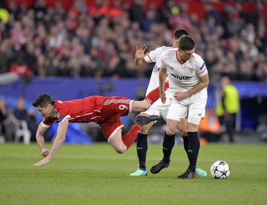 03 04 2018 Football UEFA Champions League 2017 2018 Quarter Finals FC Sevilla FC Bayern Munich at the Ramon Sanchez Pizjuan Sevilla Spain v left Robert Lewandowski FC Bayern Munich against Clement Lenglet Sevilla FC