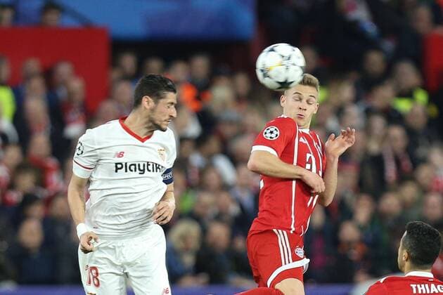 In duel action header duel with Sergio Escudero 18 Sevilla FC and Joshua Kimmich 32 FC Bayern Muenchen Sevilla FC vs Bayern Munich Muenchen Quarter-Finals Champions League 03 04 2018 Sevilla Sevilla Spain Copyright: xkolbert-press ChristianxKolbertx