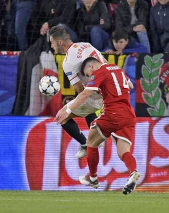 03 04 2018 Football UEFA Champions League 2017 2018 Quarter Finals FC Sevilla FC Bayern Munich in the Ramon Sanchez Pizjuan Sevilla Spain v Pablo Sarabia Sevilla in the match against Juan Bernat FC Bayern Munich just before the goal to 1 0 Juan Bernat FC Bayern München reclaimed in this scene on handball by Pablo Sarabia FC Sevilla
