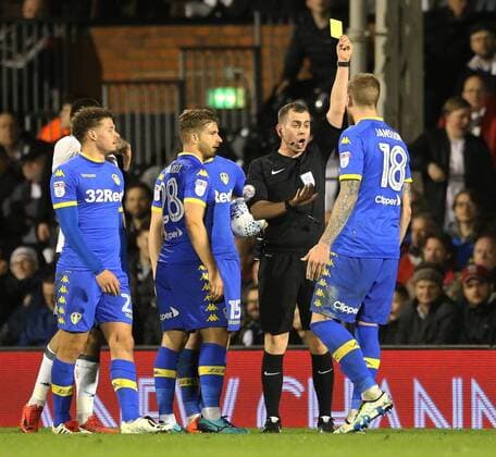 Fulham v Leeds United Sky Bet Championship Pontus Jansson (r) of Leeds United receives a yellow card during the Sky Bet Championship match at Craven Cottage, London Content Not Available For UK Newspapers Copyright: xSimonxMoorex FIL-11603-0009