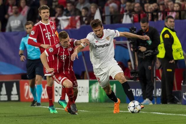 Spain Sevilla 03 04 2018 UEFA Champions League 2017 18 Season Quarter finals First leg Sevilla FC Bayern Munich Joshua Kimmich FCB and Franco Vazquez FCS in a duel DeFodi048