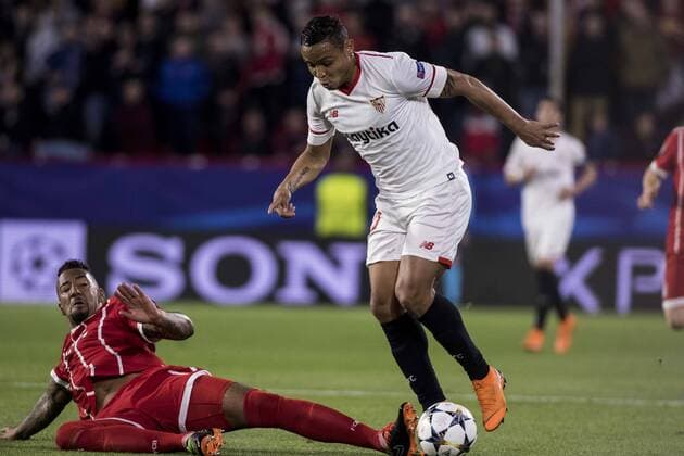 April 3, 2018 - Seville, Spain - JEROME BOATENG of Bayern (L ) vies for the ball with LUIS MURIEL of Sevilla (R ) during the UEFA Champions League Quarter-finals (first leg) match between Sevilla FC and FC Bayern Munchen at Estadio Ramon Sanchez Pizjuan Soccer 2018 - Sevilla FC vs FC Bayern Munchen - ZUMAa142 20180403_zap_a142_038 Copyright: xDanielxGonzalezxAcunax