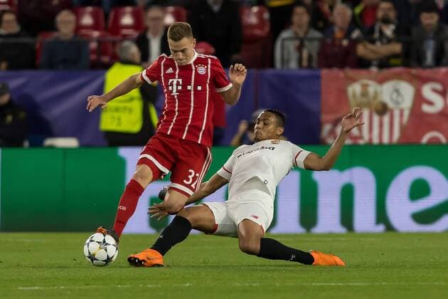 Spain Sevilla 03 04 2018 UEFA Champions League 2017 18 Season Quarter finals First leg Sevilla FC Bayern Munich Joshua Kimmich FCB and Luis Muriel FCS in a duel DeFodi048