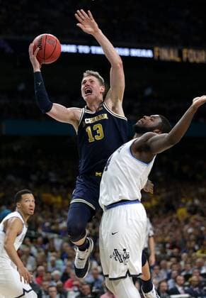 April 2, 2018 - San Antonio, TX, USA - Michigan forward Moritz Wagner (13) drives to the basket against Villanova forward Eric Paschall (4) during the NCAA College League USA division 1 men s basketball national championship game between Michigan and Villanova on Monday, April 2, 2018, at the Alamodome in San Antonio, Texas. Villanova won, 79-62. Villanova wins NCAA Championship 79-62 over Michigan - ZUMAm67_ 20180402_zaf_m67_065 Copyright: xJunfuxHanx
