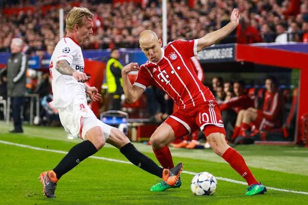3rd April 2018, Ramon Sanchez Pizjuan, Seville, Spain; UEFA Champions League football, quarter final 1st leg, Sevilla versus Bayern Munich; Kjaer of Sevilla FC and Arjen Robben of Sevilla FC challenge for the ball  ActionPlus12008228